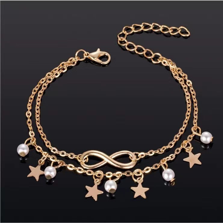 "Dainty pearl star infinity anklet with silver chain, elegant ankle bracelet for women, perfect summer beach jewelry gift."