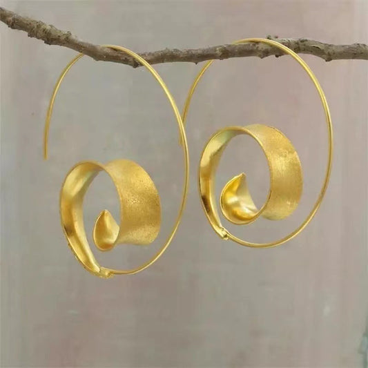 Pair of vintage round spiral earrings with retro-inspired design, elegant statement jewelry for women, perfect for gifts and special occasions.