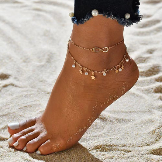 "Dainty pearl star infinity anklet with silver chain, elegant ankle bracelet for women, perfect summer beach jewelry gift."